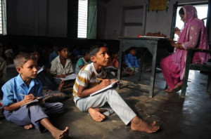 They’re doing good: pencils and paper! So many don’t have that. And it’s 60 students, sitting on the floor.