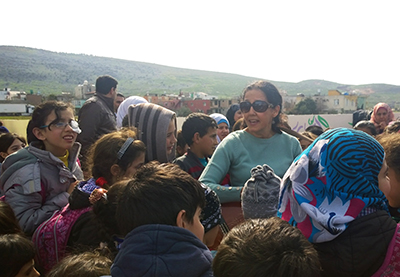 Singing with the school kids, hills of Syria in the background.