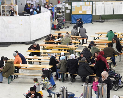 refugees at tables